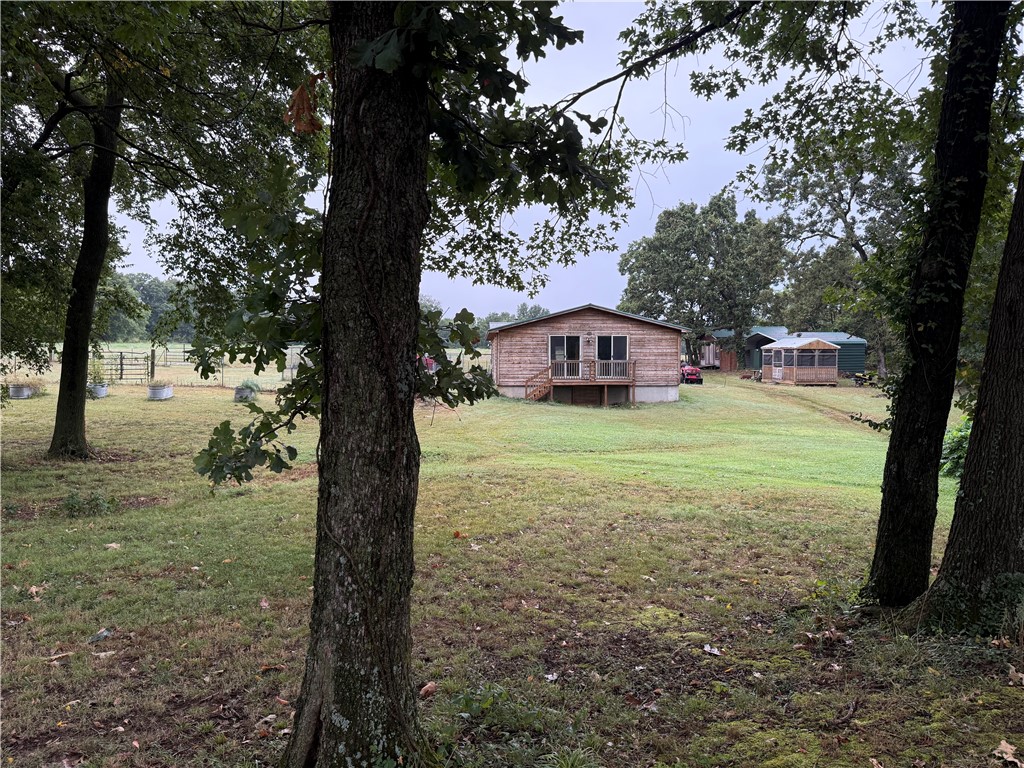 Opportunity awaits!!! This unique country home could be yours! This 2 bed/2.5 bath home with 5 acres gives you an opportunity to live in the country but be close to the amenities. Just 25 minutes from XNA and about 30 minutes from Walmart Home office. Northside Elementary school is just down the road. Home is private and secluded. Just the right mixture of woods and cleared areas. Sit on your back deck and drink your morning coffee while watching nature go by. Start a hobby farm or just create your own little paradise. More land is available if desired, call for details. Home has multiple listings, MLS 1318229, 1315040, 1318222 (withdrawn but still available), 1316069 Agent owned