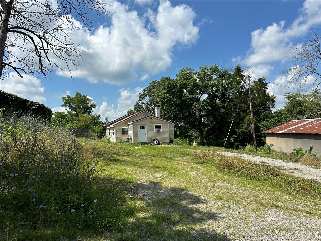 This charming 1960s country home has been recently remodeled & updated, offering 3 BR & 1 BA on approximately 20 acres in beautiful Marion Co. Built w/low ceilings to conserve heat, the home now features modern upgrades including a newer metal roof & efficient mini-split units for heating and coolingāblending vintage charm with todayās comfort. Chicken coop & shop building. The land once served as open pasture and, though it has grown up over the years, it's full of potential with just a bit of TLC. Located with direct access off paved HWY 125, the property sits just minutes from a public canoe launch on Crooked Creekārenowned for its smallmouth bass fishing, kayaking, & canoeing adventures. Only 7 miles from Yellville, you'll have easy access to groceries, gas, hardware, churches, & restaurants & everything you need while still enjoying the peace of the countryside. Whether you're looking for a weekend retreat, or a place to build your country dreams, this updated property offers a rare opportunity in the Ozarks.