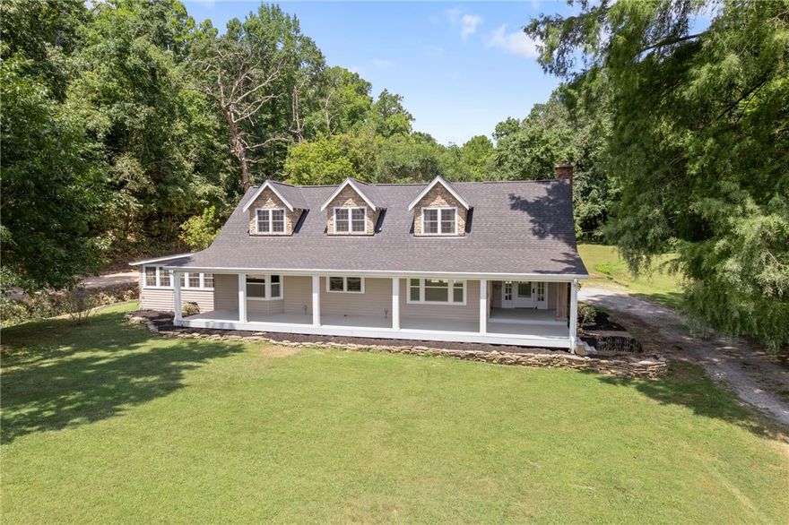 Step into a world of opportunity with this historical log home w NEW UPDATES and its accompanying structures, nestled on the banks of Little Sugar Creek. The property features a stunning 3,000SF two-story red barn, perfect for working spaces on the ground floor, while the upstairs loft stands as a favorite highlight of the entire farm. The expansive 12,000SF shop building is a true gem, w/ 5,500sf of heated and cooled space, ensuring comfort year-round. This remarkable facility includes a 1,280sf living area complete w a kitchen and bath, making it ideal for guests or long-term stays. The shop also features a 640sf loft and an office w/bath, insulated walls, and ceilings, 3 rollup doors and five walk-in doors. The reinforced floor at one end is ideal for vehicle maintenance repair.  This unique property offers endless possibilities. It could serve as a fabulous event or retreat center or comfortably accommodate multiple branches of the same family. located along the trail of tears  and civil war trail.