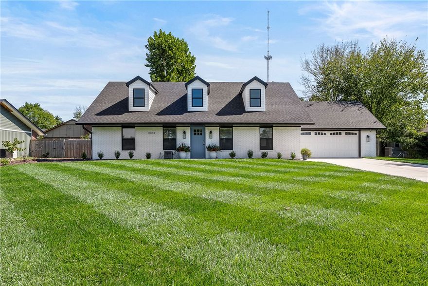 Welcome Home! A rare find in the heart of Bentonville! This home delivers style, thoughtful updates, and an excellent location all in one! Charming remodeled 4-bedroom, 2.5-bath home on fabulous large lot providing timeless curb appeal with modern updates. An extensive renovation in 2024 features a gorgeous open floor plan, custom kitchen with quartz counters, custom cabinets, and island seating. Main level living with modern staircase design, Master bedroom/Bath, and 2nd bedroom down or office/flex space. Upstairs features 2 large bedrooms and beautifully updated bath! Recent improvements include full kitchen remodel, new flooring, paint, windows, blinds, landscaping/irrigation added, new garage doors, new vinyl siding/gutters/facia, fresh exterior paint. Unbeatable quiet location minutes to Coler Mountain Bike Preserve, Downtown Bentonville, Schools, Shopping and Restaurants. Hurry to make it yours!