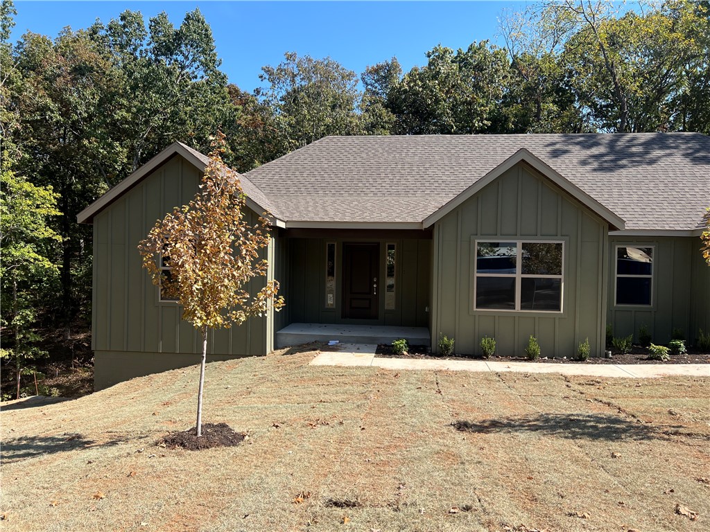 Explore this new 3-bedroom, 2-bathroom home, in the Bentonville School District. This property features a 2-car garage, granite countertops, LVP flooring in the main living areas and a tree-lined yard for added privacy. Located just moments from Huntley Gravity Park and Tunnel Vision trails, it offers the ideal blend of modern living and outdoor convenience. Gutters to be included.