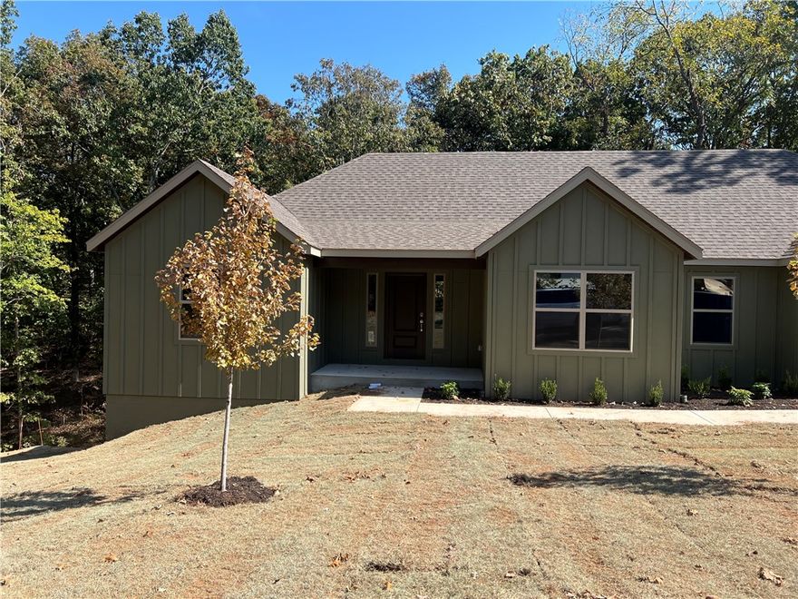 Explore this new 3-bedroom, 2-bathroom home, in the Bentonville School District. This property features a 2-car garage, granite countertops, LVP flooring in the main living areas and a tree-lined yard for added privacy. Located just moments from Huntley Gravity Park and Tunnel Vision trails, it offers the ideal blend of modern living and outdoor convenience.  Gutters to be included.