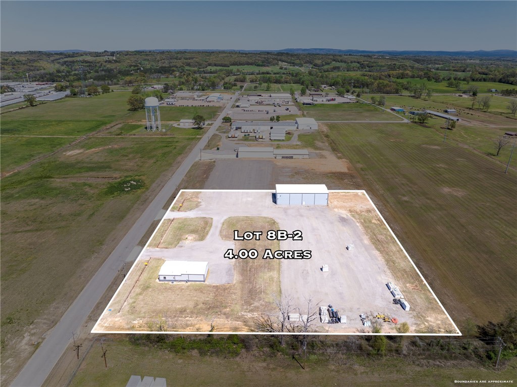 One 1800 sq. ft., newly remodeled building with central H/A, new roof & offers 900 sq. ft. of office, with kitchen full bath & attached 900 sq. ft. shop with half bath. Als on a 5000 sq. ft. warehouse with new roof, 24 ft. side walls, 8" concrete floors, 2 OH heaters, 480 electric service. Both on sewer, water, gas & electric. 3 phase available, graveled parking area, excellent I-40 access.