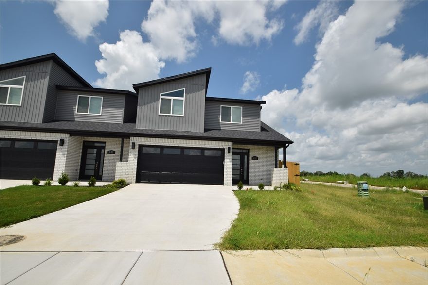 New modern design duplex! Also included brand new side by side stainless refrigerator, washer, and dryer. This 3 bed 2 1/2 bath plan has an open living concept with tall ceilings and tons of natural light. Kitchen has granite countertops, stainless appliances, a large pantry, and a gas range. Primary suite is on the main floor and has a beautiful walk-in shower and a large walk-in closet. Two bedrooms upstairs with a full bath and landing area. Wood look tile in the main living areas, 2" faux wood blinds, extra storage in the upstairs attic. Property has a private back patio and wood privacy fence. Owner must approve pets and no smoking.