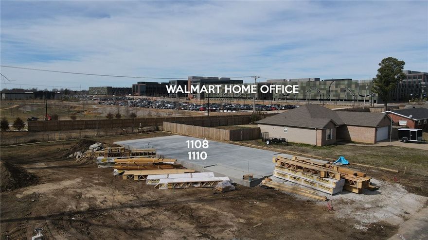 Currently under construction, this sophisticated three-story single-family attached home offers elevated design, premium finishes, and an exceptional location backing onto the Walmart Home Office and Bentonville’s renowned trail system. This thoughtfully designed residence features 3 bedrooms, 2.5 baths, and an attached garage, blending modern functionality with upscale comfort. Interior highlights include Cabira Quartz countertops, premium KitchenAid appliances, a stylish fireplace insert creating a warm focal point in the main living space, spacious walk-in closets, and an open, light-filled layout ideal for both everyday living and entertaining. Located in the heart of Bentonville, this home offers effortless access to walking and biking trails, dining, shopping, and the area’s vibrant arts and culture scene. A rare opportunity to own new construction in one of Bentonville’s most desirable locations—where modern luxury meets Bentonville living.