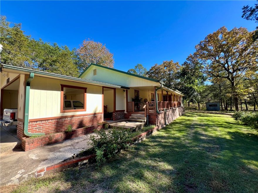 Big Piney Creek frontage over 2 acres bordering The Creek and bridge. This property offers two homes, the smaller home is a two bedroom one bath with a sitting porch and metal roof. The larger Home offers a split floor plan with larger bedroom offering its own bath with walk-in shower and a walk-in closet. Both homes have permanent brick foundations and improved metal roofs with large porches that are covered overlooking the creek. Large carport for RV parking also a detached 2 car carport and a 2 car attached garage. Chicken coop, fire pit, flowing creeks, large trees and rock formations. A storm shelter is on the land. Walk to the creek and swim or enjoy year round fishing at its finest in your front yard. This property has a one-of-a-kind location and would make a wonderful investment with two homes. Both homes are modular homes with improvements.