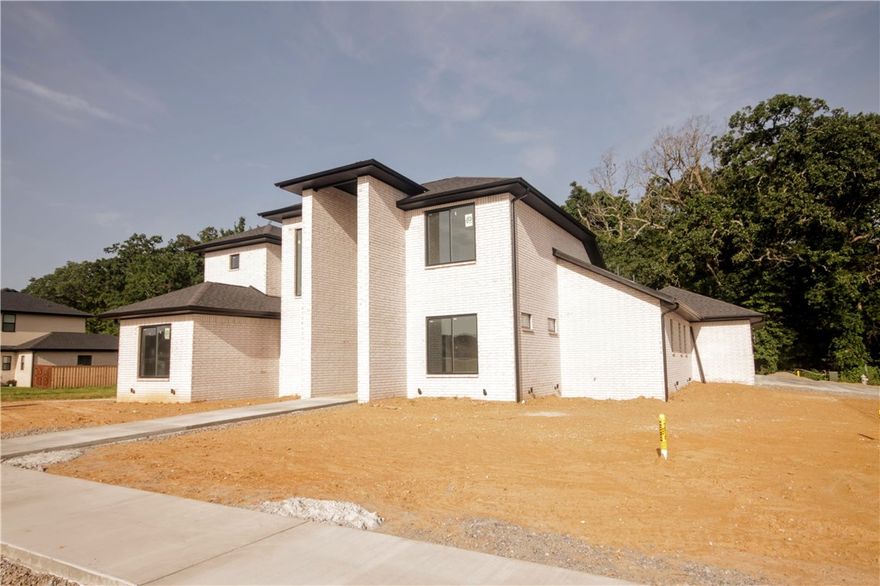 New construction modern home with gorgeous exterior in sought after gated community of Scissortail.
Enjoy the stunning living room with custom beams, tiled linear fireplace, tons of light streaming through
ample amount of windows and open floorplan. Kitchen
features large island, stainless steel appliances, gas
cooktop, custom cabinets, pot filler, double ovens, walk in pantry and storage! Home also features a home office/study on the main level. Spacious, private master bedroom with luxurious master
bathroom. Master bath with double sinks, storage, walk-in tile shower and soaking tub. Secondary bedroom with walk in closet and private bathroom on the main level and upstairs features
two large bedrooms with their own bathrooms. Huge secluded covered patio perfect for entertaining backing up to wooded area!