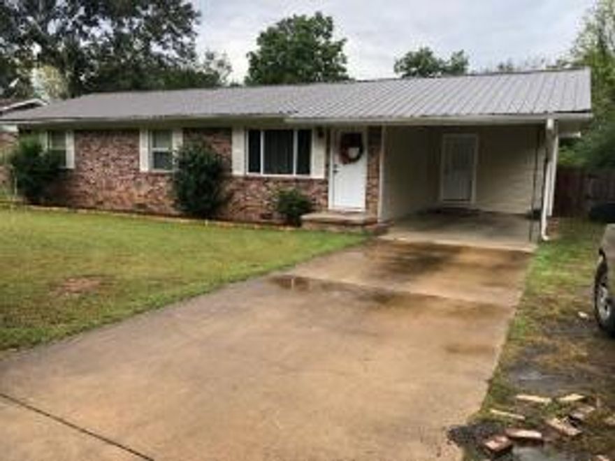 Lots of updates.... newer AC unit, new flooring in living room, kitchen and hall, new hot water heater & both bathrooms redone. This 3br 1.5ba   brick home on dead end street also offers deck and privacy fenced backyard and a metal roof. The half bath offers a shower and toilet, but no sink. All the bedrooms have original hardwood floors.