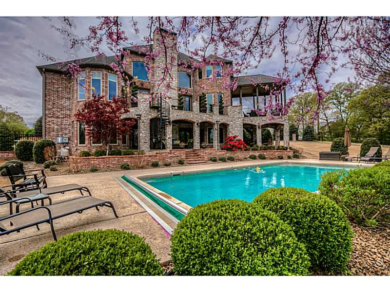 This Talamore Estate offers incredible views from every window. Enjoy privacy and nature while entertaining from one of the many backyard patios. Relax in the custom in ground heated pool. Immaculate quality throughout in this unique designer home!,Hardwood floors enhance the main level. Massive master suite has more than ample closet space. Second level with large cozy bedrooms. Lower level provides multiple entertainment areas: media room, game room, exercise room, 2nd kitchen and 2 studies/office