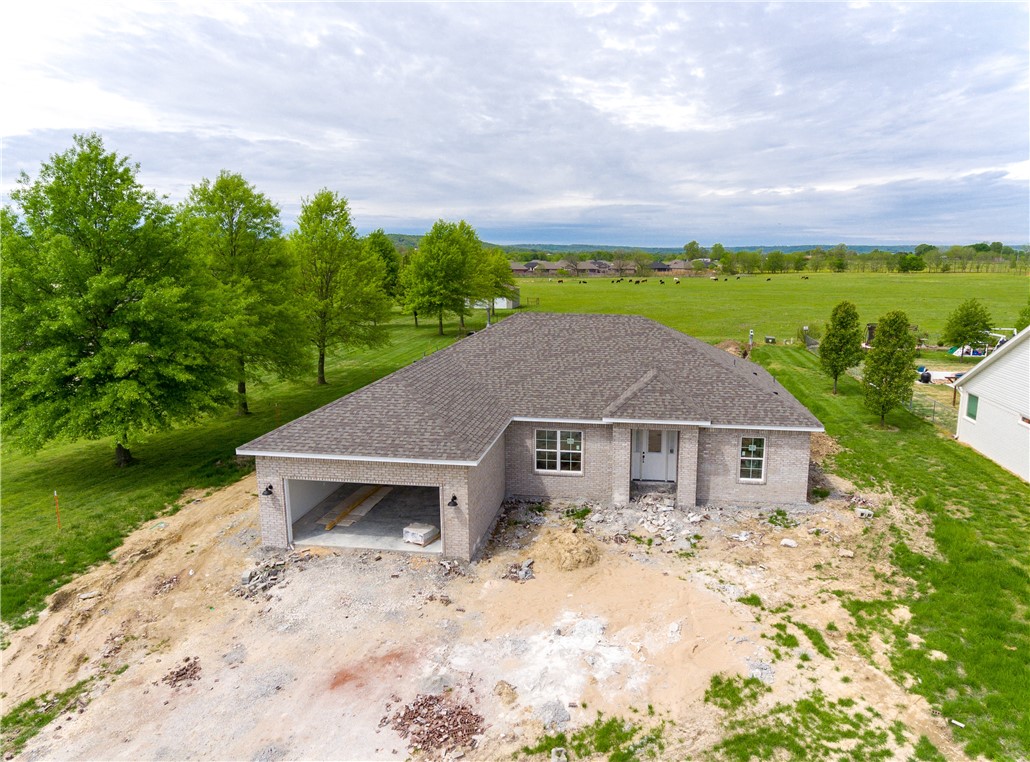 Brand new one level home being built on large half acre! Home features a spacious open layout, large kitchen island, low-e windows, granite counter tops, hardwood floors, stainless steel appliances and so much more! Approximately 2166 square ft., 4 bedrooms, 2 bath. 4th bedroom is set up to make a great home office if desired. Get in now, and pick your finishes and colors from builders selection! Pictures are of floor plan but some features or finishes may vary. 1 year builders warranty included!