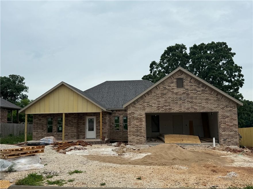 Striking new construction with 3 bedrooms plus an office featuring a modern brick and siding exterior, covered front porch, and clean architectural lines. This home backs up to the POA Green Space. Inside, tall ceilings and expansive windows create a bright, airy atmosphere throughout the open living space. LVP flooring to be installed throughout home - no carpet. Kitchen has stainless appliances including a gas range, and an oversized island accented by stylish pendant lighting. The primary suite offers a peaceful retreat and a spa-inspired bath showcasing a fully tiled walk-in shower. Secondary bedrooms provide flexibility for guests, office, or any other needs. Energy-efficient construction, modern lighting and thoughtful design details throughout. Conveniently located in a growing neighborhood with easy access to parks, schools, and everyday amenities.
