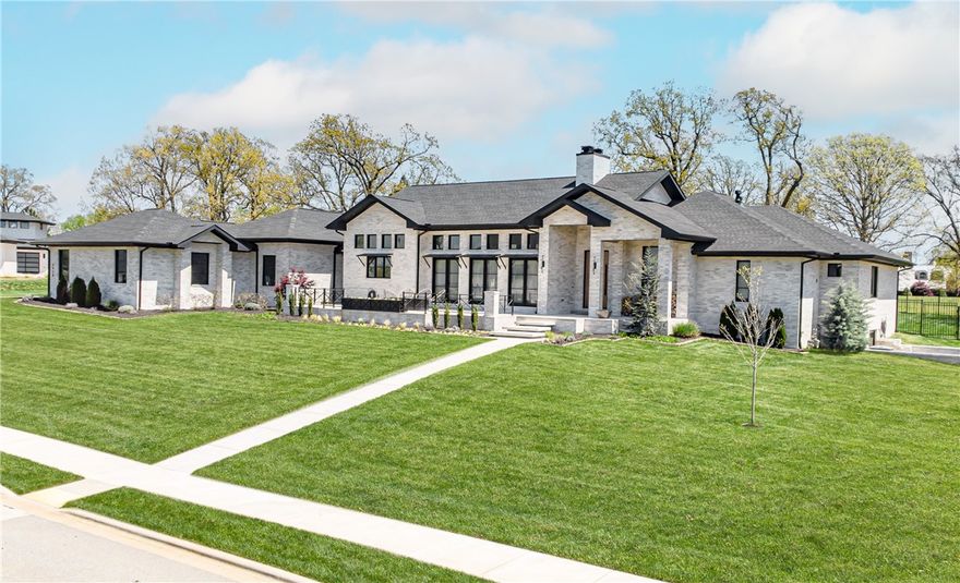 Stunning Rogers home on over 1 acre! This 1 lvl, split floor plan home boasts an open living/dining area with vaulted ceiling and wood beams. Kitchen features a large island, 2 wine fridges, and large built-in fridge. The master suite has an oversized walk in shower, jetted tub, his/hers closets with built-ins, and pool area access. This home is ideal for entertaining as the living room has sliding glass doors open to the back patio and french doors opening to the front patio. The backyard oasis has a heated in-ground pool, fire pit with seating area, and outdoor kitchen complete with dining space. Enjoy sunsets on your front porch while sitting by the 2nd outdoor fire pit. The 4 car garage boasts an electric car plug. Additional amenities include F5 tornado shelter in the office plus additional storage under the home. Located in the exclusive Estates at Southgate, this gated community is only minutes from shopping, dining, and top schools. Make this immaculate home yours!