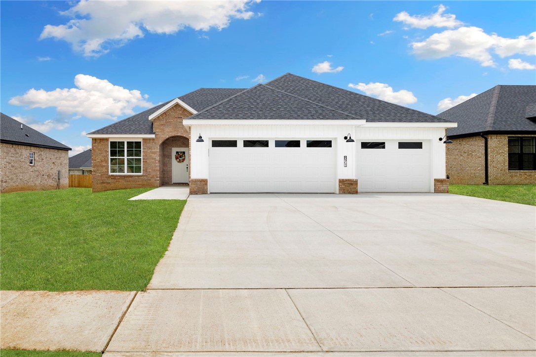 Contemporary living meets small town charm! This quality-built new construction home features an incredible open concept/split floorplan with on-trend upgrades like luxury vinyl plank flooring, a drop zone with built-ins off the 3-car garage, ceiling-height kitchen cabinets, granite countertops, under-cabinet lighting, pocket office with double doors for privacy, pantry, gas fireplace, and covered deck. You’ll love the easy flow of the laundry room connecting to the owner’s suite! Situated conveniently off the bypass in one of Prairie Grove’s most desirable areas, Mountain View Estates gives you a quick commute to i-49 whilst cozying into a quaint downtown scene best known for antiquing, aquatic park, and its rich history. Become a part of this vibrant, tight-knit community plus enjoy fast access to all your favorite Fayetteville amenities... truly, this wonderful home offers the best of both worlds!