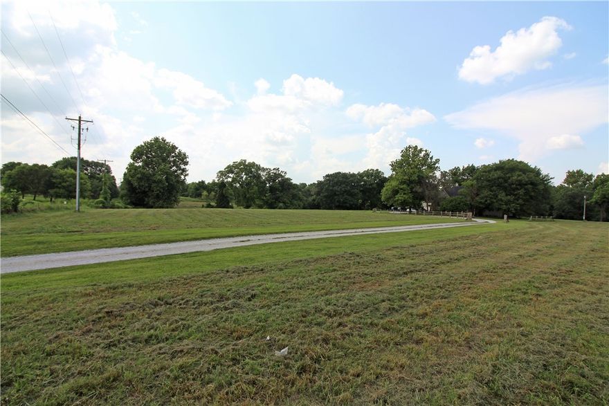 Please see MLS 1192897. A gem of a find! This gorgeous parcel of land has a 4 bedroom 3 bath 2 level home situated on East side of property. Mature trees, Spring fed pond, plenty of flat land, timber & rolling hills to divide into small acreage lots or subdivision. Zoned agriculture now with potential for development. The home is currently on septic & well water. City utilities at street. Super location with approx. 776 ft. of Town Vu  Rd. frontage.