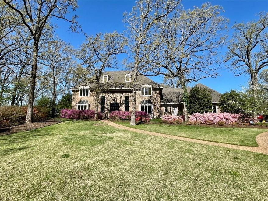 Very hard to find 1 acre lot with magnificent home in the middle of Fayetteville.  Western winter views from the expansive wood deck.  Many trees cover this well landscaped front and backyard.  Double staircase in entry.  3 well sized bedrooms complement the enormous master suite.  Approximately 4300 square feet of heated and cooled living space plus oversized 3 car garage.  Stainless kitchen features double ovens, gas countertop stove, large island, breakfast area, and easy access to the deck.  Formal dining room and game/formal living room off of entry.  Panel lined study.  Plenty of built-ins for extra storage.  Wood burning fireplace in living room.