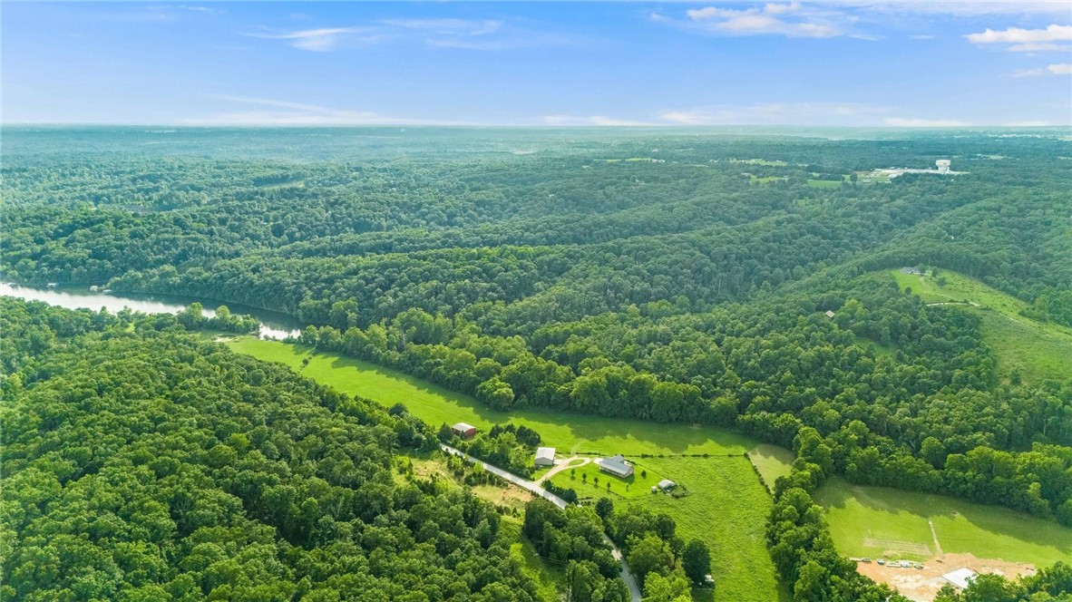 Searching for your place on the Beaver Lakeās shoreline? This prime 30.51 acre property, with a private boat dock including 2 slips, may be your spot. But, thereās more! This property is a functioning farm/pasture graced by magnificent, rolling countryside while offering multiple possible building-sites. It also has a 40x50 shop. The parcel has a completed perc test from about 3 years ago too. Come see this amazing piece of property which boasts beaver shoreline on 3 sides. Realize your dream!