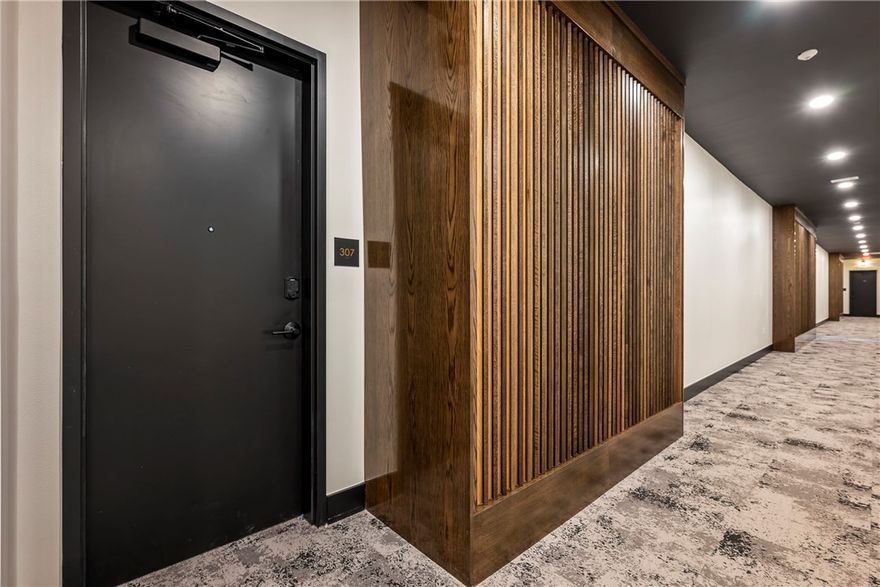 Meet the Rothko—the only one-bedroom residence on the penthouse level of THE HAVEN. This home proves that “one bedroom” does not mean compromise. The kitchen is exceptional, rivaling those found in much larger residences, with elevated finishes and craftsmanship that will surprise the most discerning buyer. High ceilings and dramatic triple glass sliders create an open, light-filled living space, while a stylish coffee bar bridges the kitchen and living area beautifully. The bedroom easily accommodates a king-size bed and features a walk-through closet leading to a luxurious spa bath with floor-to-ceiling marble tile, floating vanity, and a statement shower with both rain and handheld heads. A generously sized laundry room offers hanging space and storage. Enjoy expansive views from your private balcony with a dedicated storage locker. The unit includes a private one-car garage. Ideally located for someone who wants to walk to work or enjoy the energy, dining, arts, and trail culture of Bentonville.