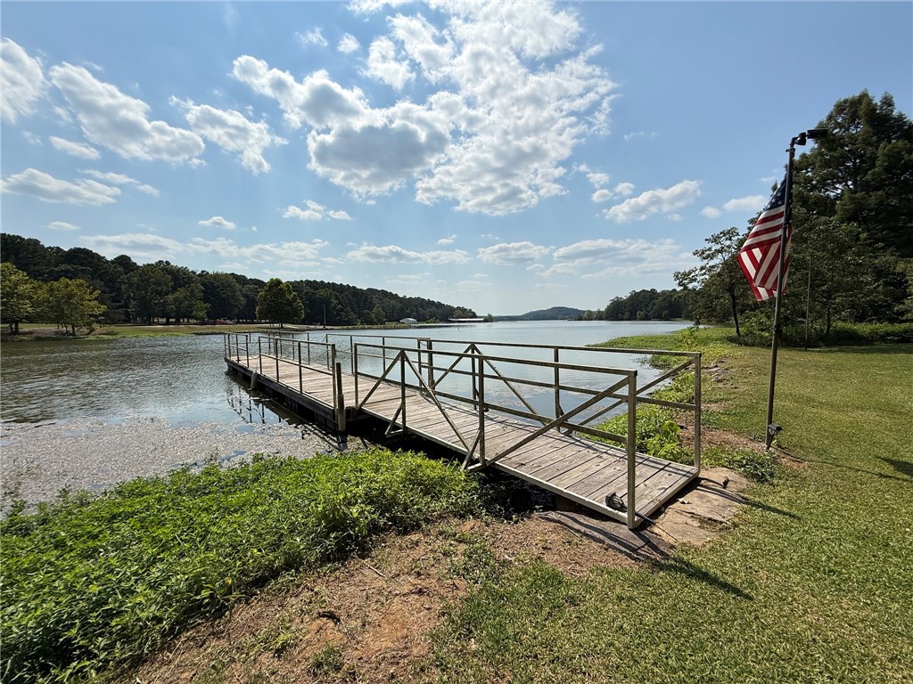 Charming Lakefront Home with Boat Dock & Stunning Sunsets
Discover the perfect blend of character and comfort in this inviting home on beautiful Lake Dardanelle. Enjoy breathtaking sunsets, exceptional views, and a private boat dock just steps from your door. Many plantings throughout the property offer seasonal surprises and delights. This 3-bedroom, 2-bath residence is located right across the street from John Daly’s 18-hole golf course, making it a dream for lake and golf enthusiasts alike. A separate 1-bedroom, 1-bath suite off the 2-car garage provides an ideal space for guests, extended family, or a private office. Features include two new HVAC units, Marathon hot water heaters, a security system, two walk-in closets in the primary suite, and oversized closets in the additional bedrooms. Spend mornings by the water, afternoons on the course, and evenings watching the sun set over the sparkling shoreline—this is lake living at its finest.