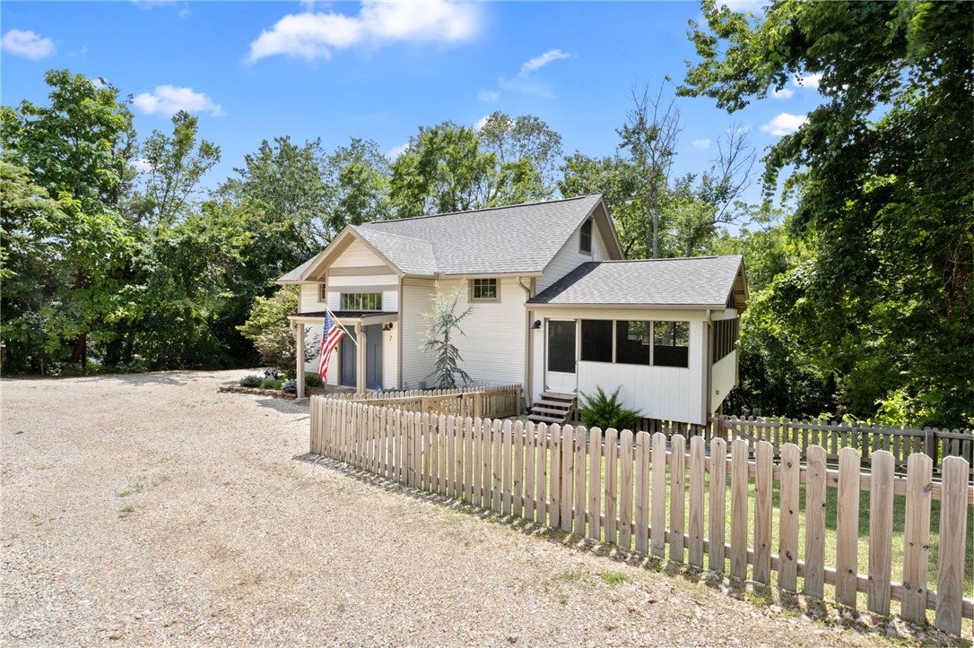 Rare opportunity in Eureka Springs! This one-of-a-kind property offers 185 feet of Hwy 23
frontage and is commercially zoned, allowing for a wide range of usesāincluding residential,
retail, office space, or short-term rentals. Originally a schoolhouse from Madison County, it was
carefully relocated to Eureka Springs in the early 2000s and tastefully updated while preserving
its historic charm. The expansive driveway and two separate entrances, create the potential for
two individual short-term rental units. Recent upgrades include a new roof (2025), new windows
downstairs and in the loft (2021), and three new mini-split HVAC systems (2021) for year-round comfort. An electric car charger adds modern convenience for todayās travelers. Two refrigerators, a washer, and a dryer will convey with the property, making it move-in or rental ready with minimal setup required. With its rich history, flexible zoning, and prime visibility, this unique property is full of charm, functionality, and endless potential.
