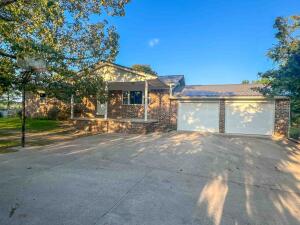 Discover the allure of this charming 3-bedroom, 2-bathroom home, located within 10 minutes of Harrison. Enjoy the abundant trees that surround the back yard from the deck. The large back yard is perfect for entertaining or to grow a garden in . Beautiful wood floors throughout the main level, as well as large windows to let natural light in. Durableconcrete siding and a modern patio door enhance the home's appeal. The partially finished basement has a large room that could be used as a den or game room. 26 panel solar system provides a minimum of 9,000kwh/year, which will keep the electric bills low. Embrace sustainable living and peaceful ambiance in this delightful home.