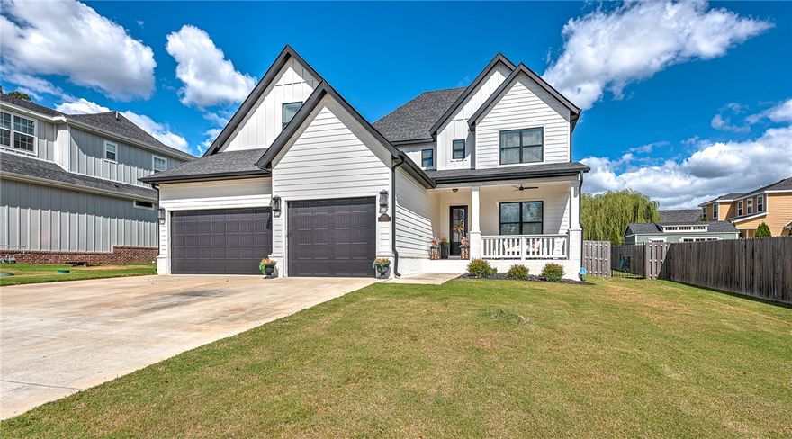 DREAM HOME.  Stunning, custom-built, 5-bedroom home w/ bonus room, 9' diving pool, on a spacious .47-acre lot, and a covered patio perfect for outdoor entertaining. Inside, the gourmet kitchen is a chef's dream, complete with white custom inlay cabinets, gas cooktop, double ovens, a built-in coffee system for the avid coffee drinker, an ice maker, beverage fridge, pantry, and gorgeous 4 cm marble countertops. Downstairs you will find the primary suite with soaking tub and separate shower, half bath, laundry, formal dining room, breakfast nook, and mudroom.  Upstairs you will find 4 bedrooms, a bonus room, 2 full baths, and a built in desk. This home has a built in vacuum system with 4 sweeps and custom 30' garage. Relax on the inviting covered front porch and enjoy luxury living in one of the area's most desirable locations, close to schools, restaurants, and shopping.  Bentonville schools.  It's a must see!