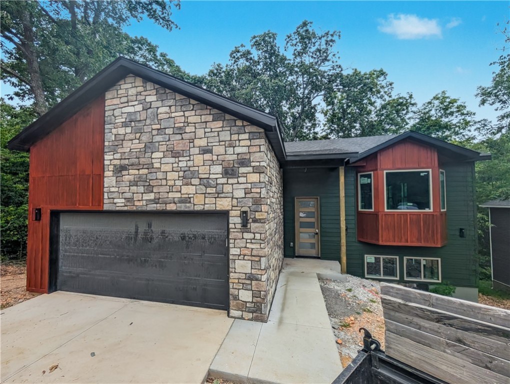 Welcome To Your Next Home! This One Has Everything! 4 Bedrooms, 3 Bathrooms, Connected To Sewer, Bentonville Schools, MTB Trails In Your Backyard! The Perfect House, The Perfect Location. The Love Is Spread Over 2 Levels, With The Main Level Offering The Primary Living Area w/ Vaulted Ceiling, Super Cool Ceiling Treatments, Kitchen/Dining, Primary Suite w/ Full Bath, Half Bath. The Lower Level Offers A Secondary Living Area, 3 Add'l Secondary Beds + Full Guest Bath, Laundry/Utility. Interior Is Loaded With Amenities - Custom Cabinets, 3cm Quartz, Tile Backsplash, UC Lighting, Full Custom Tile Showers, And So Much More. And Soooo Much House For The Price! This One Is Hard To Beat!