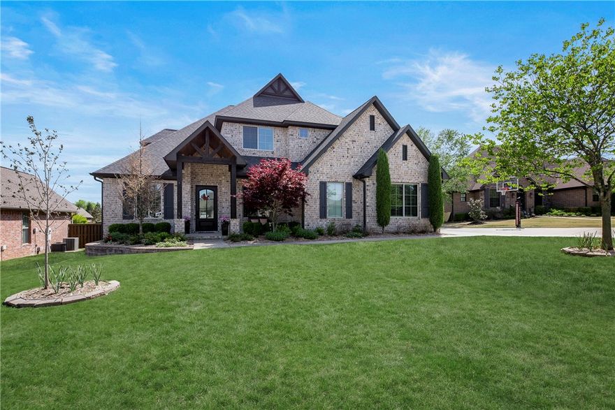 Stunning Custom-Built Home in the highly sought after Oak Tree Neighborhood!  Award-wining floorplan with everything you have been searching for in the perfect home!  Featuring 5BRs/4BA (two bedrooms on main level/three upstairs).  Open living area to gourmet kitchen with huge 12x5 island, Stainless steel Frigidaire Gallery Appliances. Double ovens, gas stove top, pot filler and walk in pantry.  Master suite with beautiful master bath featuring double vanities and relaxation tub, large walk-in shower with 3 shower heads and convenient connection between master closet and laundry room.   Huge 24 x 17 bonus/media room upstairs complete with wet bar!  Enjoy the 16 x 17 covered back patio overlooking large, fenced backyard.  Three car garage with epoxy floor and extra storage.  So many extras and upgrades in this home to enjoy!   Hurry to make it yours!