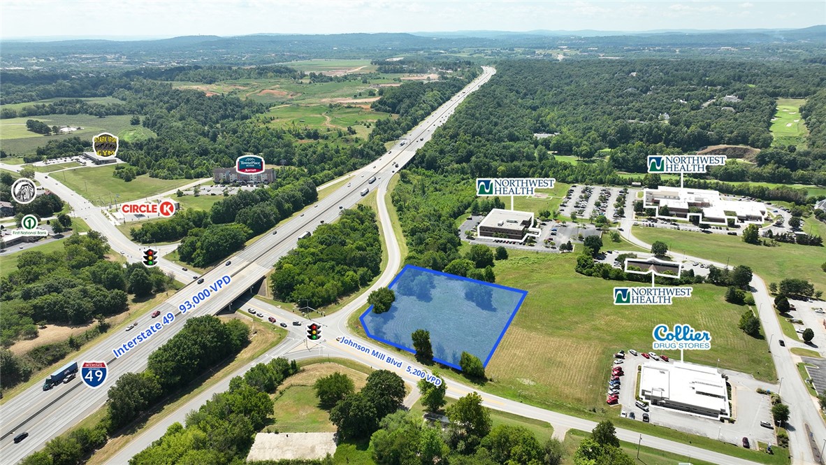 Prominent hard corner lot for sale with a traffic light, offering high visibility and accessibility to Interstate 49. Located just minutes from Johnson Square, Fayetteville’s business and shopping district, and Springdale’s thriving Care Corridor. Ideal for a convenience store, fuel station, office space, or retail use in a high-growth area. The city of Johnson is positioned in the heart of a rapidly growing area of Washington County and is a great investment opportunity.