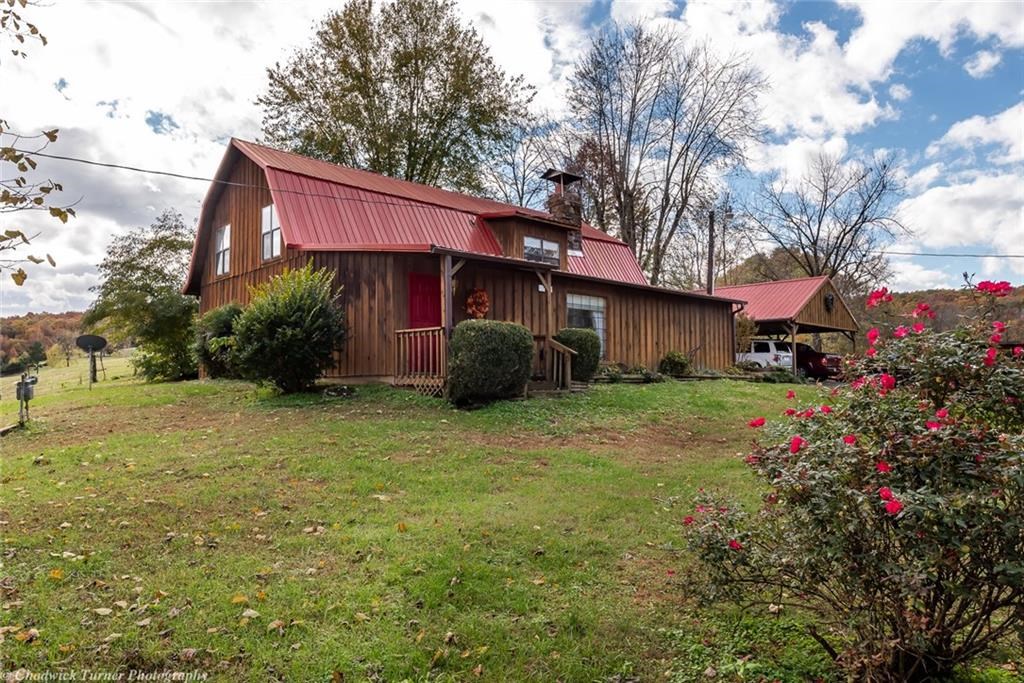 Rustic, farmhouse in the country! Home was originally built as a barn in 1936 & converted to a home in 1976. Inside this home opens up to vaulted ceilings and skylights in the living room to let all that natural light in. Spacious eat-in kitchen. Large walk-in pantry providing loads of additional storage. 4 bedroom and 2 full baths provide ample space. Enjoy time outside on the deck overlooking the large yard. Plenty of room for that summer garden. Cool off in the above ground pool on those hot summer days. Property also includes a chicken coop, greenhouse and shop. Also features a charming, historic, country church that could be used as an office or studio. Come make this your home today!