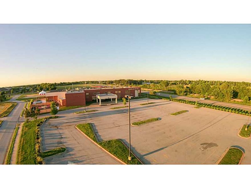 Huge gym complex. Three pools, four saunas, hot tub, changing rooms, basketball & Racquetball courts, upstairs track, offices, and more!