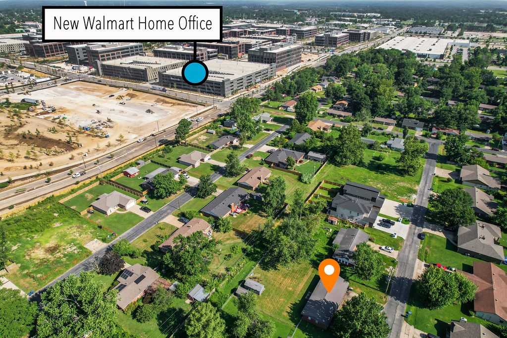 Great investment opportunity in the middle of all things Bentonville. Directly behind new Walmart campus. Quick access to I-49. Could be split into two lots for townhomes like other lots on the street have done. No lockbox present for interior showings. Cross-posted, See also RES Listing MLS# 1318442