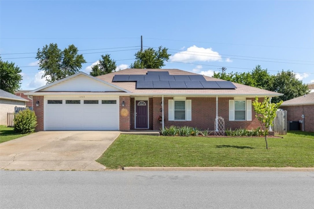 Lovely all brick ranch style home next to Bentonville High School. This 3-bedroom home offers wood laminate flooring throughout, updated bathrooms, large bedrooms, and a beautiful brick fireplace and trey ceiling in living. Kitchen with granite counters, stainless appliances, undermount sink, breakfast bar, and access to pantry through laundry area. New easy to clean tilt in windows throughout, full gutters, newer HVAC, and huge fenced yard with storage shed!