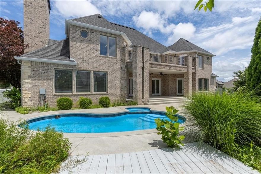 Located inside the prestigious gated Pinnacle Country Club, this elegant Colonial-style home offers timeless design and resort-style living. Featuring 4 spacious bedrooms, each with a private bath, plus 2 half baths, this home is designed for both comfort and entertaining. The expansive chef’s kitchen opens to the main living area and includes a gas range, double ovens, large island, walk-in pantry, and abundant cabinetry. Soaring ceilings and multiple living spaces, including a media/game room, provide flexibility for today’s lifestyle. The primary suite is generously sized with a spa-like bath. Step outside to your private backyard retreat with an in-ground pool, covered patio, and mature landscaping. Circular drive and 3-car garage add to the curb appeal. Enjoy close proximity to golf, shopping, dining, and trails in one of NWA’s most sought-after communities.