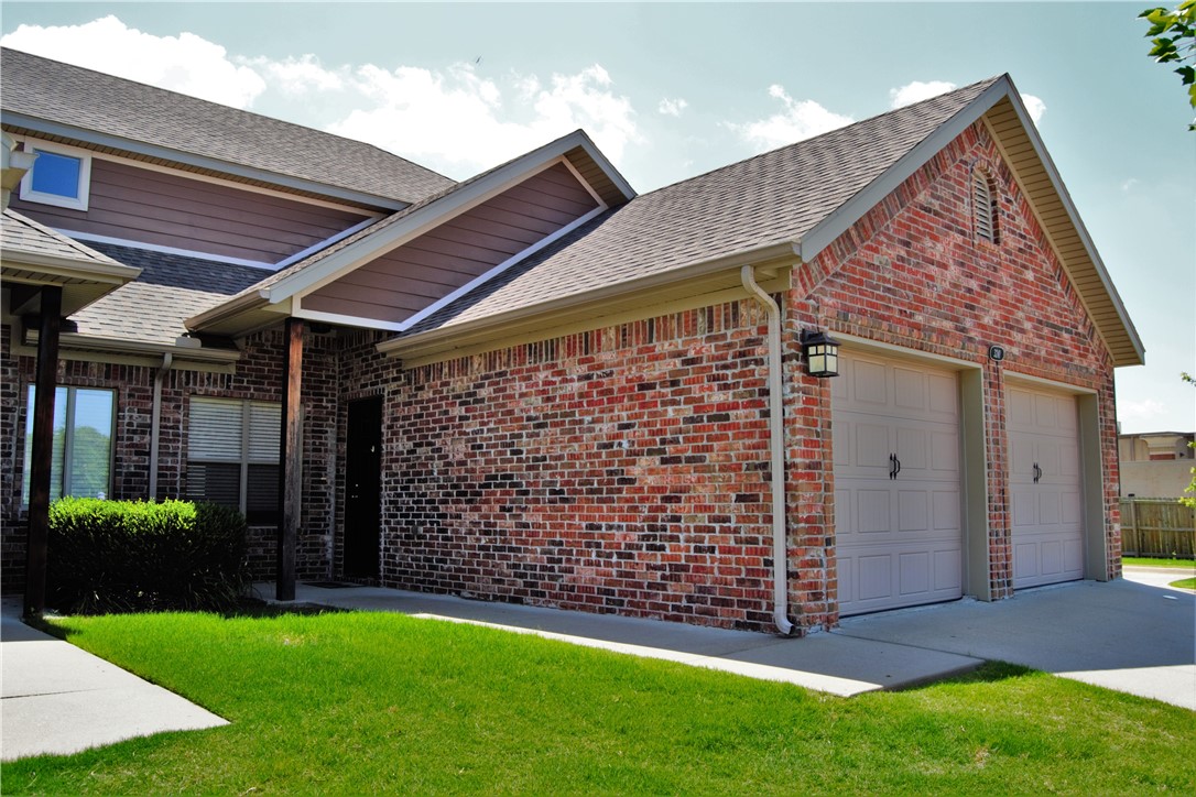 Fantastic 3 bedroom townhome with 2 full baths, and 2 car garage! Great location off Wedington (behind Harps) and easy commute to U of A campus or I-49 access. Spacious open concept living, back patio off kitchen. Primary bedroom with connecting bathroom downstairs; 2 beds, 1 full bath upstairs, and an upstairs bonus room that could be used for office/study space, storage, play/game room, or even an extension for extra closet space! All appliances included; full size washer & dryer with laundry room that walks out to the 2 car garage. Unit is currently occupied - please do not disturb tenant. Photos are of a like unit and are representative of the finishes within the complex. No showings until July 15. Available for August move in.