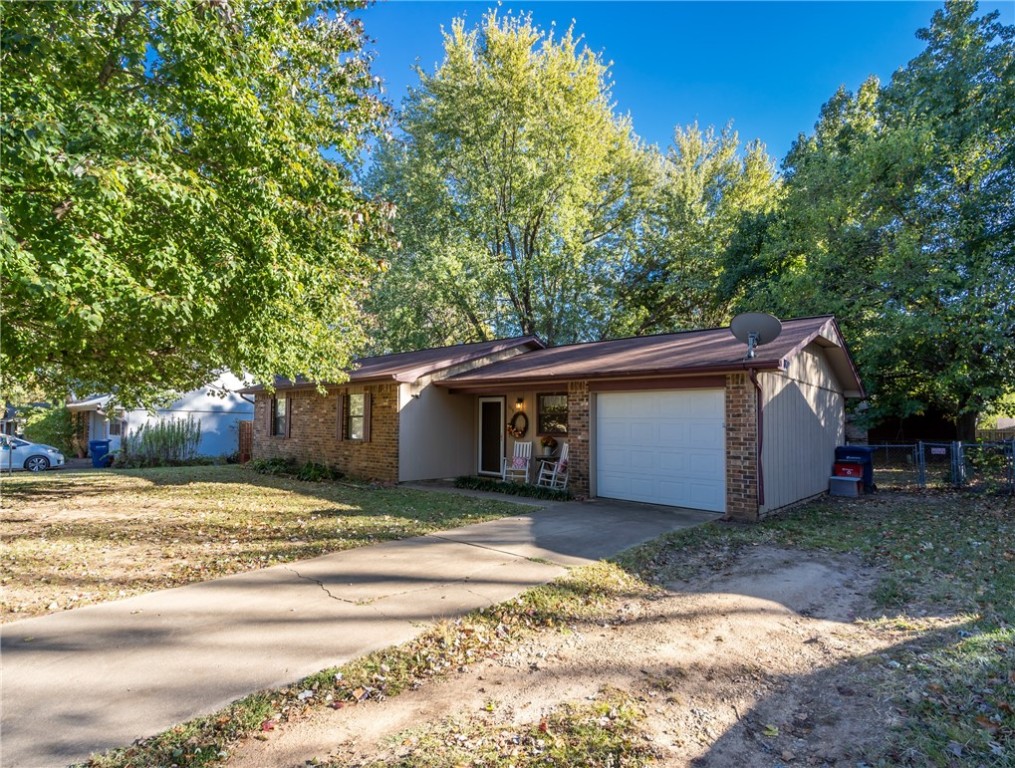 Beautifully maintained home in perfect condition. Desirable location close to schools, walking and bike trails, shopping, Boys's and Girl's Club & Siloam Springs Senior Activity Center. Has new interior paint and new wood laminate flooring. This three bedroom 2 bath home is a perfect starter home or investment opportunity. Large backyard is fenced and pet friendly.