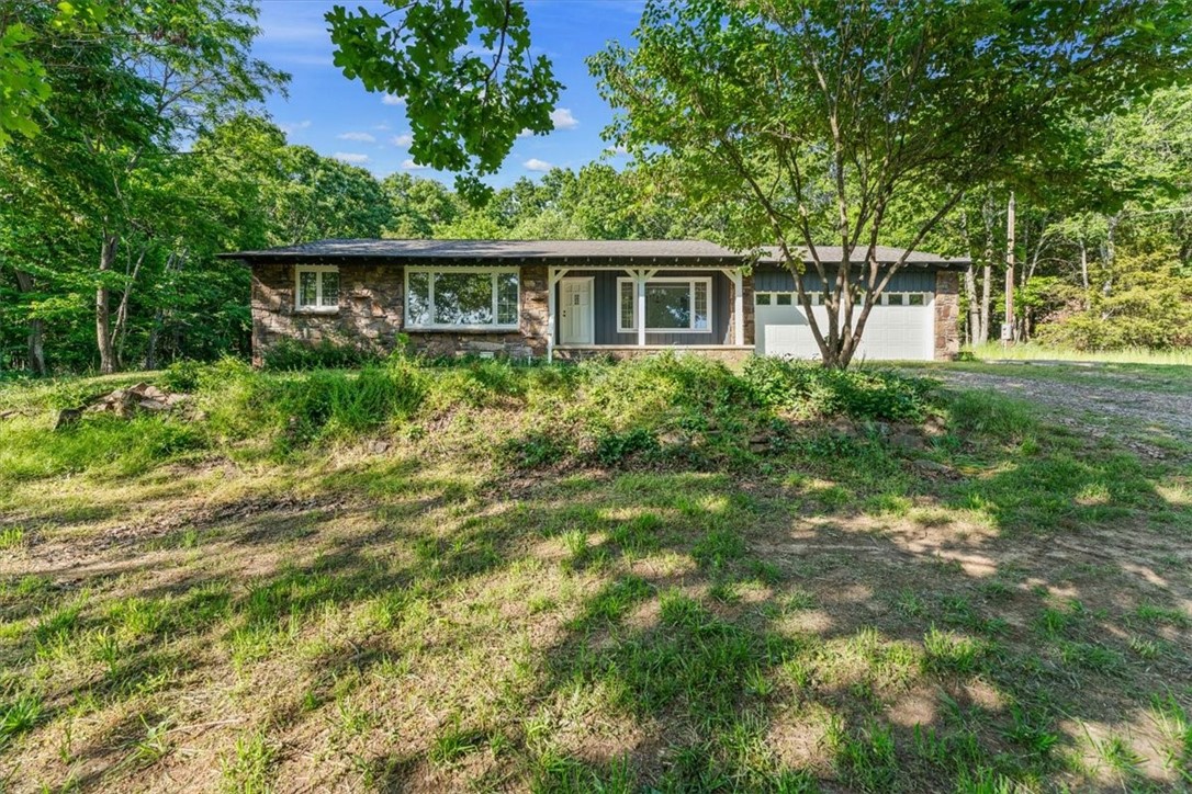 Sold before print: Completely remodeled home on 9.76 beautiful wooded acres! This 3-bedroom, 2-bath home features a brand-new roof, fresh interior and exterior paint, updated flooring throughout, modern light and plumbing fixtures, stylish new bathrooms, and updated kitchen with new countertops and appliances. Enjoy both a cozy living room and a formal living room, plus a formal dining room—ideal for entertaining. Step out onto the brand-new back deck or relax on the front porch with a scenic view. Easy access to I-49 offers both privacy and convenience. A must-see retreat with room to roam! //AR Agent Owned//