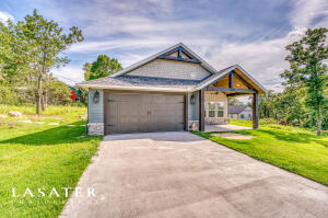 Discover your dream lake retreat! This custom-built 3-bed, 2-bath home with a view is move-in ready. Whether you're seeking a vacation haven, an investment property, or a permanent residence this property offers it all. Step inside to find an inviting open floor plan, featuring a spacious great room perfect for entertaining guests. The kitchen is a chef's dream, showcasing custom cabinetry, a top-of-the-line appliance package, and a convenient island for meal prep & socializing. The primary suite is complete with a walk-in closet featuring custom cabinetry & an ensuite bath offering additional comforts. Don't miss out on the opportunity to own a piece of lakeside paradise. Schedule your viewing today and make this stunning property yours!