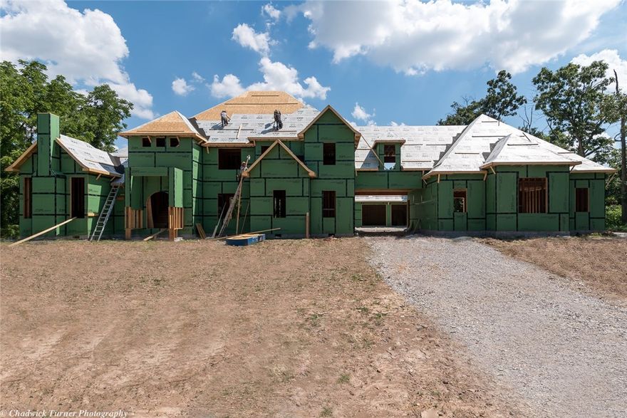 Stunning 6,213 SF Estate in prestigious area located on resort style 2.7 acres.  This stunning
Home in Talamore will have the finest high end finishes with no expense spared.
This home features 5 bdrms/5 baths,  2 ft. floor trusses, 3 staircases, wood pella windows, top of the line heat & air, 10 inch touch screen monitored from your  iphone, cast iron tubs, granite, hardwood floors, front door provided by UDI. Man cave room w/wet bar, tornado shelter. Your outdoor kitchen is perfect for entertaining,