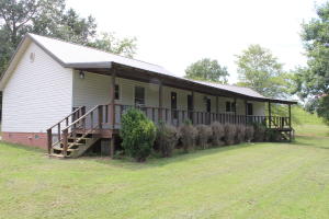 Spacious 3 Bedroom, 1.5 bath home sitting on just over 1 acre just a few minutes from the Clarksville city limits. The house has an updated galley kitchen, open living room, and a bonus room. It has a metal roof, outbuilding, and a storm shelter. Enjoy the evenings on your extended covered deck! Boasting a nice large yard, this house is sure to be perfect for your family. Don't miss out on this one!