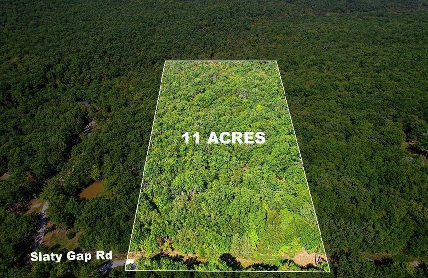 Build your dream home on this beautiful 11 plus acres that feels remote but is less than 15 minutes to downtown Fayetteville. Enjoy quiet and solitude of the woods but with all the conveniences of close access to town and the I49 corridor.  With no covenants and no POA you can build the home of your dreams.  Sit on your porch and watch wildlife in the woods or do a little bow hunting off your back porch! OzarkGo fiber internet and electric is available at the street.  Only a limited number of water taps available on this road, so don't wait too long.  Don't miss this fantastic opportunity to have a small hobby farm, barndominium or a weekend get-away spot.