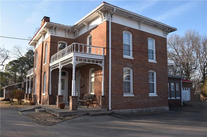 In the Colonel Young House, one of Bentonville's oldest homes, you'll enjoy exposed brick details, large rooms & a place on the Historic Record near the Walmart Distribution Center. The 1st level of this home includes 2 Bed Rooms & is handicap accessible w/ a ramp & one fully handicap accessible bathroom including bathtub. The 2nd floor features a landing/living room with gas fire place, kitchen and 2 additional bedrooms. 4 Baths, 4 BR, 3 fireplaces, tile floors, & gas generator - must see in person.