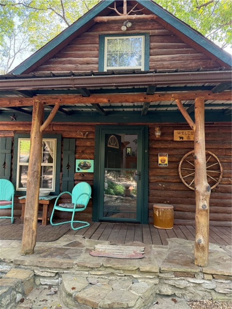 Cozy Cabin on 5 acres just minutes from Berryville. Home owner has created a zen garden with little alcoves to sit and enjoy nature, outdoor shower, shop and storage building. Hiking trails marked with stone  cairns that guide you around the 5 acres and a perfect spot for watching the sunset on the Ozark Mtns.
Log Home has beautiful yellow pine floors, loft bedroom, full bath (with composting toilet). A small creek runs through the property.