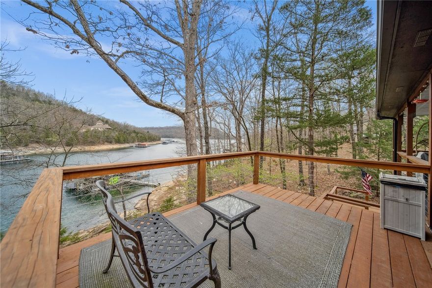 Welcome to your dream lakefront retreat on Beaver Lake! Nestled amidst the natural beauty of Fern Hollow, this stunning property offers an unparalleled combination of comfort, and lakefront living at its finest. With 1,984 sq ft of living space, this residence is designed for both relaxation and entertainment. The living spaces boast large windows that frame breathtaking views of the lake, allowing natural light to fill the rooms creating a connection between the indoors and the picturesque outdoors. This residence features 3 bedrooms, 3 full baths, 2 living rooms, sunroom, and 2 decks providing ample space for family and guests. Includes a 2 car detached garage, 2 10x26 boat slips with lifts. You will love having quiet, beautiful sunrise mornings, sunny days on the lake, and evenings cozying up around the firepit. Whether you're relaxing on the deck, or the dock, this property offers an unprecedented lifestyle. The home next door is also listed if someone is looking for adjoining properties and co-owned boat dock.