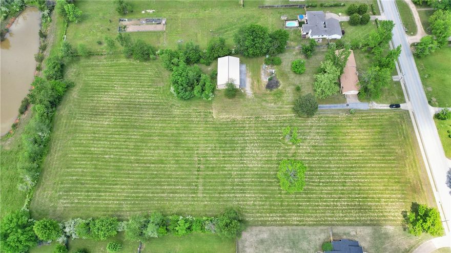 Prime development opportunity in the heart of Rogers! Just a short walk to Rogers High School, this 5-acre buildable parcel is currently zoned T2-Rural—a low-intensity district with potential for rezoning to match the city’s Future Land Use Map. Ideal for a small multifamily pocket subdivision, the property features approximately 325 feet of frontage on 21st Street and backs up to land owned by the Rogers Public School District. Great potential for builders and investors looking to capitalize on a growing area!