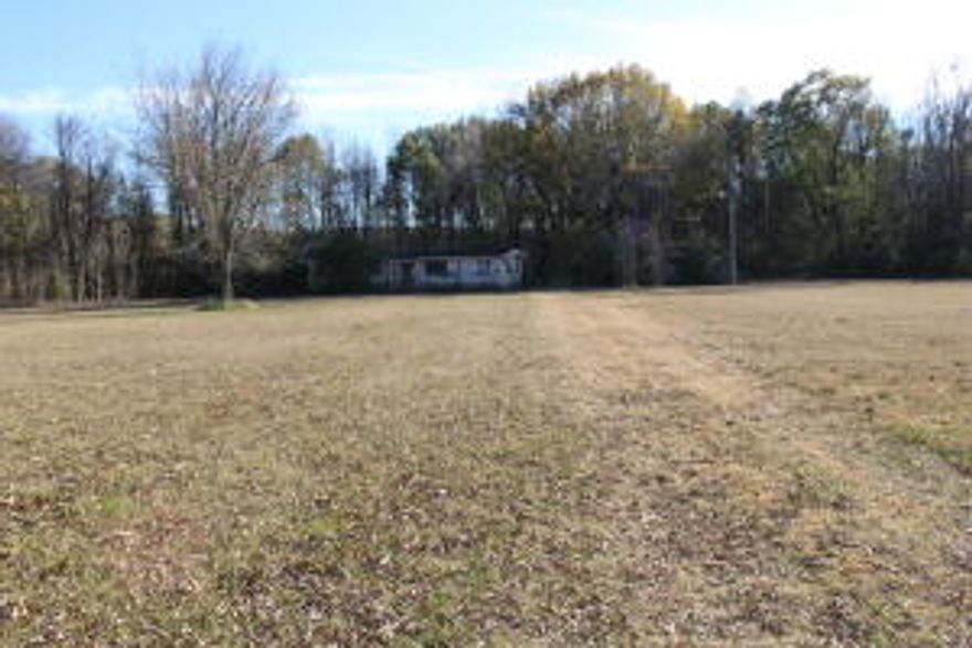 This property includes an older mobile home requiring repairs, set on a spacious 3.5-acre lot. The land is mostly cleared and level, with a scattering of trees adding natural charm. Ideal for those seeking a renovation project or a fresh start, this property offers plenty of potential in a serene and private setting. Mobile Home is being sold ''as is''.
