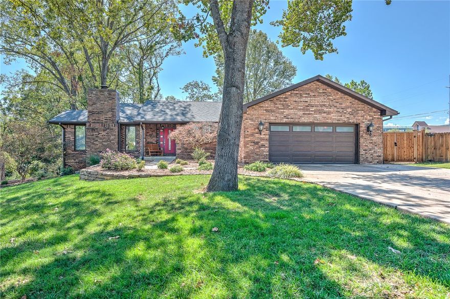 WELCOME TO A ONE-OF-A-KIND GEM TUCKED AWAY ON A PICTURESQUE 1.14 ACRE SETTING IN A PRIME LOCATION WITHIN WALKING DISTANCE TO ALICE WALTON SCHOOL OF MEDICINE, CRYSTAL BRIDGES, THE NEW WALMART HOME OFFICE CAMPUS, DOWNTOWN BENTONVILLE, ORCHARD PARK, DOG PARK, SCHOOLS AND TRAILS!! The main level has been beautifully renovated and features top of the line amenities including solid walnut ¾’ wood floors, wood burning cast iron fireplace, private master suite w/ spa-like bath and a fabulous custom closet! The sleek and modern kitchen features custom bamboo cabinetry, Viking double ovens and Jenn-Air gas cook-top! Recently updated walk-out basement w/ 2nd family rm w/ wet bar, 350 sq ft oversized 4th bedroom/bonus, 168 sq ft exercise/bonus and 189 sq ft of unfinished storage space! The park-like setting boasts beautiful outdoor living spaces! Fully irrigated w/ invisible fence around the full 1.14 acres 10 x & 22 detached workshop! NEW GENERATOR, FURNACE, CARPET AND PAINT! An exceptional and rare find that can’t be beat!