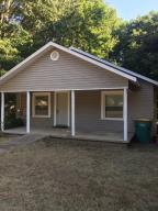 Older home on large 100 x 142 R2 lot with huge trees ....would make good starter home or Tech Rental....is wheel chair accessible....Seller is offering property ''as is''.