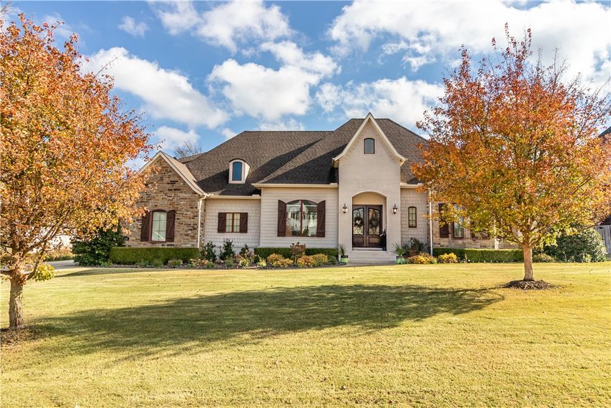 Architecturally designed, extraordinary home on a professionally landscaped 1 acre lot in East Fayetteville! This former builder show home is sure to impress! Stunning curb appeal, interior designer finishes, storage galore, smart home features, and attention to detail throughout this custom home. This move-in ready property includes 4 bedrooms, office, large bonus room, 3.5 baths, 3 car garage, central vac, security system, sprinkler system, and is wired for sound. Hardwood floors, coffered ceilings, a stunning chandelier, and a wall of windows highlight the floor-to-ceiling stone fireplace with matching built-ins on either side of the living room. An open floor plan, the kitchen features granite countertops, double ovens, pantry, island with breakfast bar, and tile backsplash. Perfect for entertaining with a heated, 22K gallon pool, lounge area, green space, covered patio with fireplace, and mature trees. Updates include new AC, furnace, and primary carpet in 2024, and new water heater and pool heater in 2022.