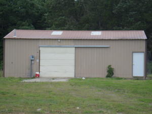 NEW!!!! 2 acres M/L, boundaries are the North fence, west fence hwy on the east and 15' south of the south tree line, acreage is approximated a survey will be needed to determine exact acreage. Totally remodeled down to the studs, electrical, plumbing windows, fixtures, water heater, too much to list. Spacious livingroom with a fireplace for gas insert, new laminate wood floors, new carpet, new tile, new solid wood doors, new window frames, new exterior door,new cabinets, roof is only 4 years old, HVAC unit is approximately 6-7 years old, three beds and 2 baths with a large laundry room and a largeshop/garage building in the rear of the property. Natural gas heat will convey with the property for FREE as long as the gas company provides! THIS IS A STEAL at 89000, propertyappraised