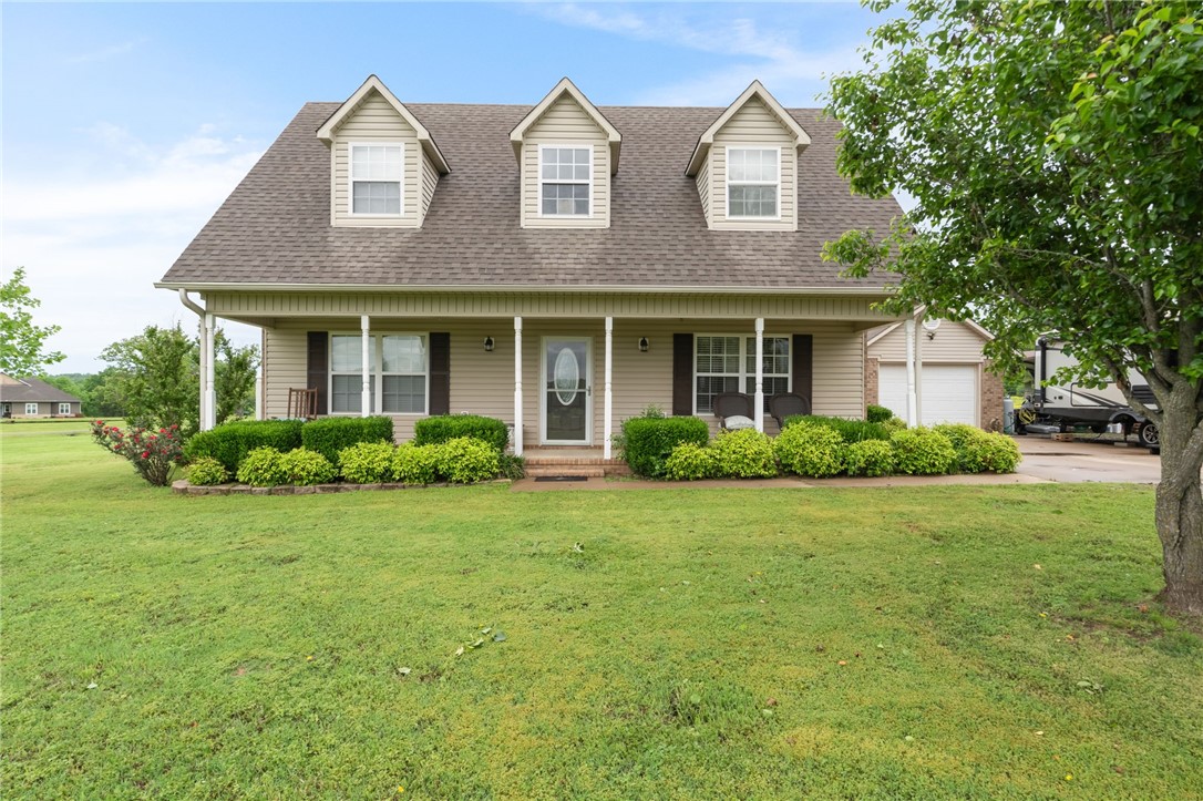 This gem is nestled in an immaculately groomed neighborhood with a well-maintained, open floor plan, 3-bedroom home. Large open gathering room opens onto the fully-fenced outdoor living space and pool area. Spacious kitchen with marble tile counters. Front porch runs the full length of the house with plenty of room for rocking chairs and enjoying country living. A 2-car garage with an additional detached carport for outdoor toys & equipment.